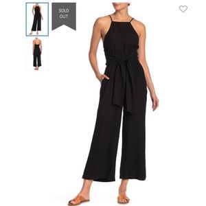 Fun linen blend jumpsuit with a tie waist belt